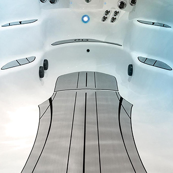 Nonslip comfort floor system on bottom of a MP Swim Spa.